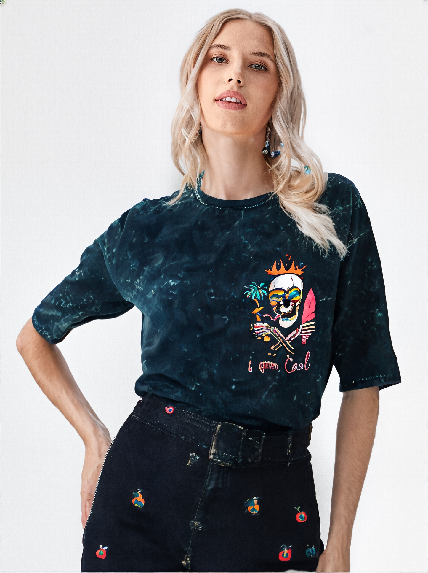 Woman wearing a dark blue distressed t-shirt with a colorful graphic design on a white background