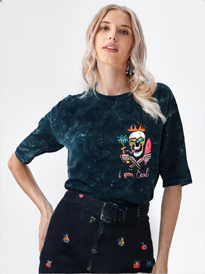 Woman wearing a dark blue distressed t-shirt with a colorful graphic design on a white background